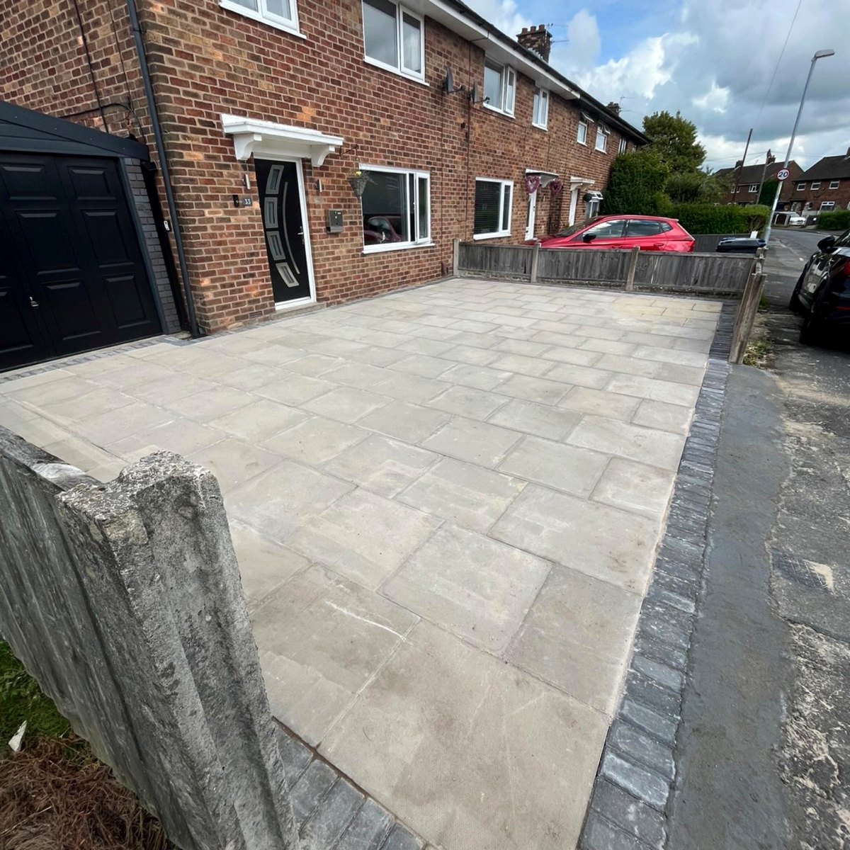 Flagged front driveway on a brick terrace